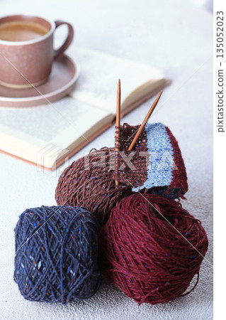 Multi-colored wool yarn for knitting. Tweed yarn. Knitting with needles. The concept of "Hobby for women". Knitting Accessories Multi-colored wool yarn for knitting. Tweed yarn. Knitting with needles. The concept of "Hobby for women". Knitting Accessories 135052023