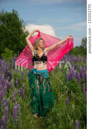 B dancer performing in a vibrant lavender field under a blue sky B dancer performing in a vibrant lavender field under a blue sky 135052770