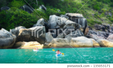 Blurred Tropical Kayaking Adventure in Clear Turquoise Sea and Rocky Coast Blurred Tropical Kayaking Adventure in Clear Turquoise Sea and Rocky Coast 135053171
