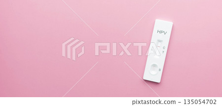 HPV test kit for cervical cancer screening on pink background. Screening tool for at home use, that checks for high risk Human Papillomavirus types that can cause cervical cancer. HPV test kit for cervical cancer screening on pink background. Screening tool for at home use, that checks for high risk Human Papillomavirus types that can cause cervical cancer. 135054702