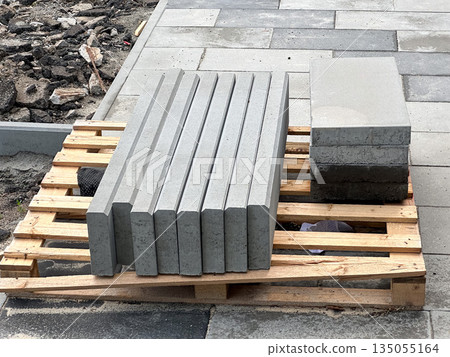 Stack of concrete blocks on a pallet at a construction site. Stack of concrete blocks on a pallet at a construction site. 135055164