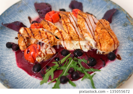 Gourmet summer fresh salad with peaches, chicken, blueberries, onion, feta cheese, basil and arugula, white background, top view 135055672