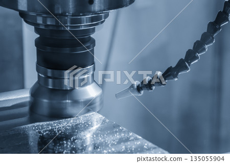 The CNC milling machine rough cutting the aluminum parts by face mill tools in the light blue scene. The CNC milling machine rough cutting the aluminum parts by face mill tools in the light blue scene. 135055904