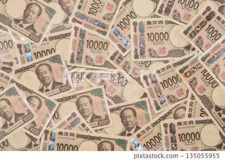A large number of 10,000 yen bills laid out A large number of 10,000 yen bills laid out 135055955