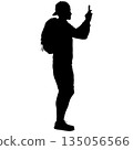 Black silhouette of a standing man on a white background 135056566