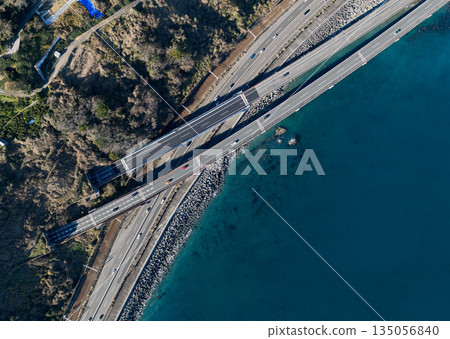 Aerial view of National Route 1, the Tokaido Main Line, and the Tomei Expressway intersecting along the Sadato Pass Aerial view of National Route 1, the Tokaido Main Line, and the Tomei Expressway intersecting along the Sadato Pass 135056840