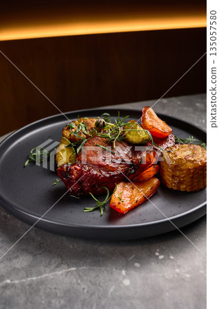 Grilled Steak with Roasted Vegetables and Fresh Herbs on Plate Gourmet Dish Presentation, culinary concept 135057580