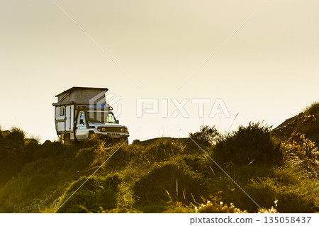Off road vehicle with roof top tent camping on nature 135058437