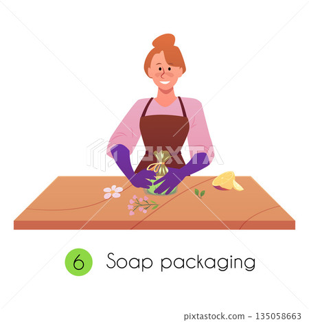 A woman in an apron and gloves at a table packaging handmade soap. A woman in an apron and gloves at a table packaging handmade soap. 135058663