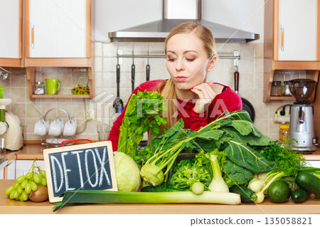 Woman having green diet vegetables, detox sign Woman having green diet vegetables, detox sign 135058821