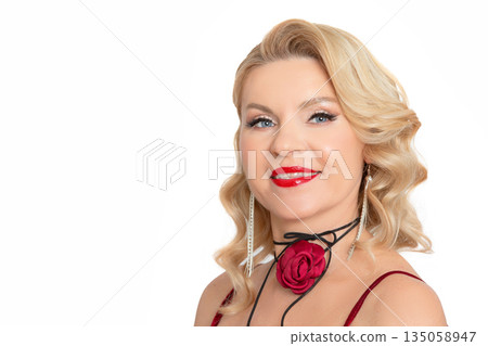 Portrait of a gorgeous middle-aged blonde woman on a white background. 135058947