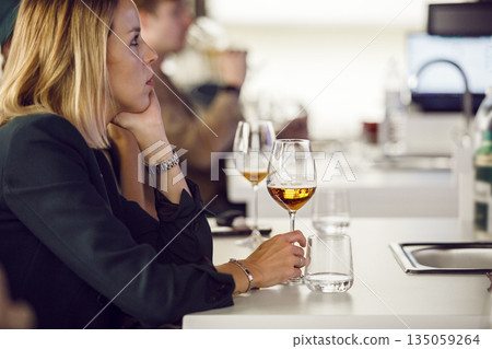 Female Sommelier on Beer Tasting Courses. Woman Participant is Training Dedicated to Making Beer and Brewing. 135059264