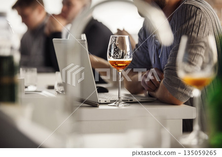 Professional Sommelier Tasting Beer During Training about Basic of Brewing and Craft Beer, Close Up. Professional Sommelier Tasting Beer During Training about Basic of Brewing and Craft Beer, Close Up. 135059265