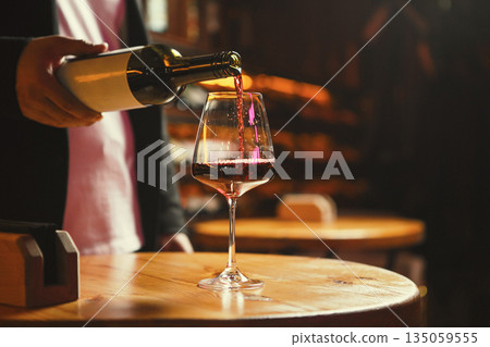 Glass Being Filled with Red Wine at Wine Bar Glass Being Filled with Red Wine at Wine Bar 135059555