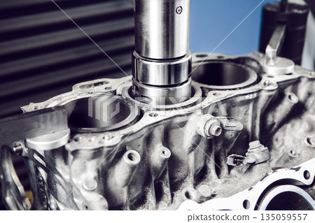 Service Boring under the piston after engine sleeve using machine with Computer Numerical Control. Engine cylinder boring on cnc machine. Service Boring under the piston after engine sleeve using machine with Computer Numerical Control. Engine cylinder boring on cnc machine. 135059557