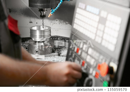 CNC milling. Numerically controlled metalworking machine makes high-precision parts. 135059570