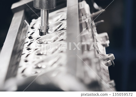 Engine Valve Seat Repair in car workshop close up. Engine Valve Seat Repair in car workshop close up. 135059572