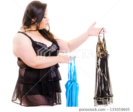 Plus size woman fitting satin nightwear Plus size woman fitting satin nightwear 135059605