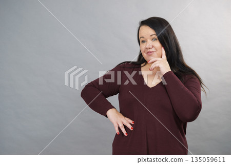 Thinking adult woman Thinking adult woman 135059611