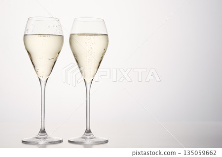 Festive composition with pair of champagne flutes. Festive composition with pair of champagne flutes. 135059662