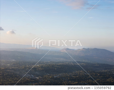 View of hills and valleys in the evening light from a high point View of hills and valleys in the evening light from a high point 135059792