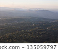 Scenic view of mountains and valleys during sunset from an airplane 135059797