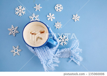 Blue monday concept. Sad face coffee mug wrapped in blue scarf 135060006