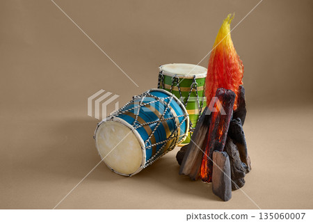 Dhol drums and bonfire celebrating lohri festival Dhol drums and bonfire celebrating lohri festival 135060007