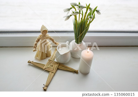 Imbolc altar with brigid doll, cross, snowdrops, candle, milk Imbolc altar with brigid doll, cross, snowdrops, candle, milk 135060015