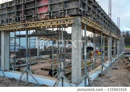 Concrete formwork with supports at a commercial building construction site Concrete formwork with supports at a commercial building construction site 135061926