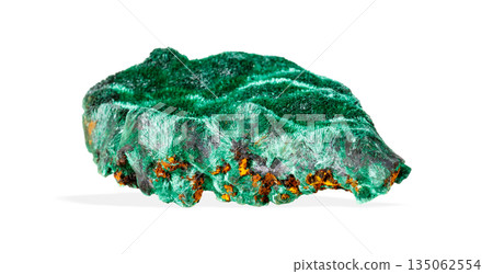 Vibrant green malachite crystal specimen with rich banding patterns isolated on white background Vibrant green malachite crystal specimen with rich banding patterns isolated on white background 135062554