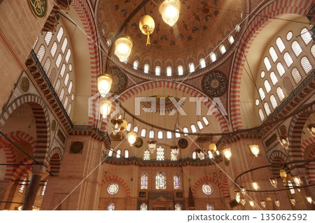 Interior of the Suleymaniye Mosque dome with hanging lamps Interior of the Suleymaniye Mosque dome with hanging lamps 135062592