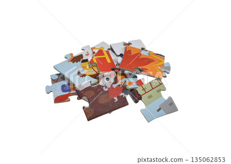 A small pile of cardboard puzzles. A small pile of cardboard puzzles. 135062853