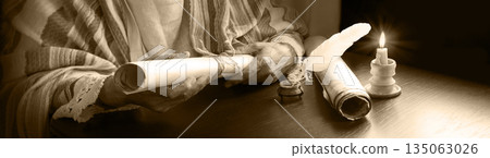 Man holding an old scroll 135063026