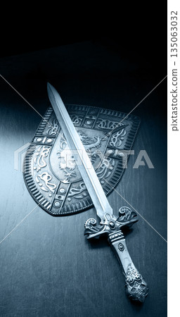Iron shield and sword on the table 135063032