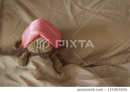 Knitted Sheep Toy Sleeping with Satin Mask on Cozy Bed Knitted Sheep Toy Sleeping with Satin Mask on Cozy Bed 135063049