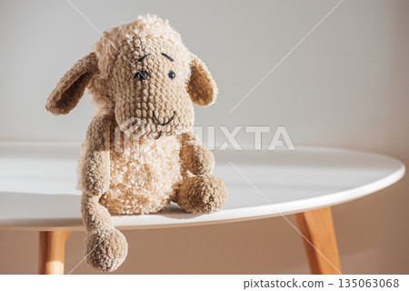 Lonely Plush Sheep on Minimal Table in Soft Light Lonely Plush Sheep on Minimal Table in Soft Light 135063068