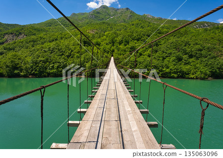 Shkopet lake with a mysterious bridge over the river 135063096