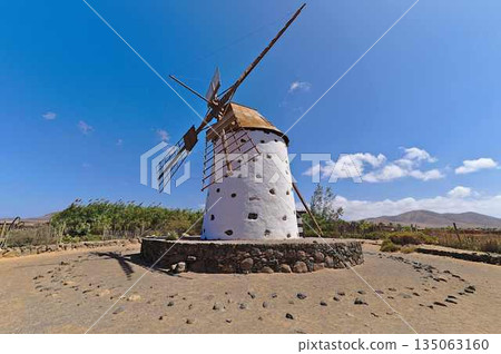 Traditional windmill on Fuerteventura with windmill sail. Traditional windmill on Fuerteventura with windmill sail. 135063160