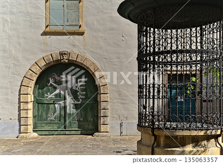Gate in the Landhaushof of Graz with well 135063357