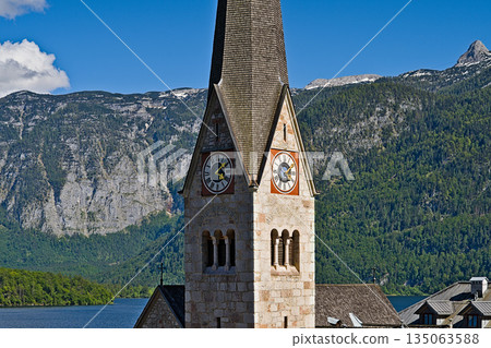 A clock tower displaying the number 141 on its facade 135063588