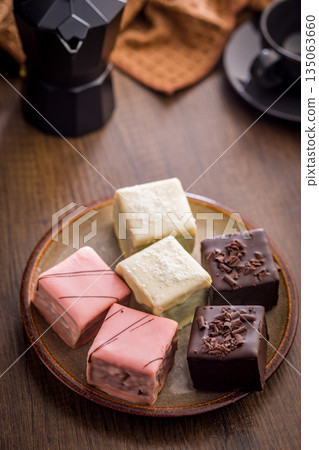 Sweet dessert cake. Mini pie on plate on wooden table. 135063660