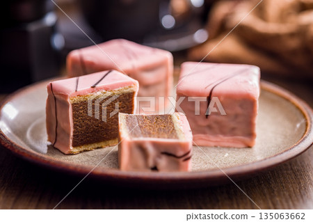Sweet dessert cake. Mini pie on plate on wooden table. 135063662