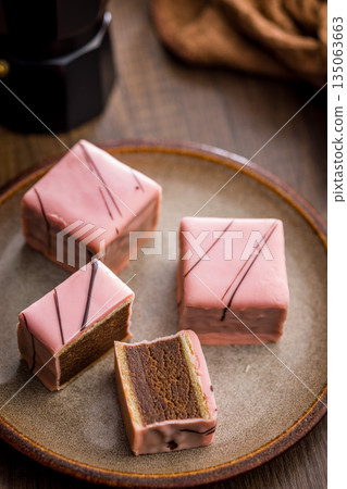 Sweet dessert cake. Mini pie on plate on wooden table. 135063663