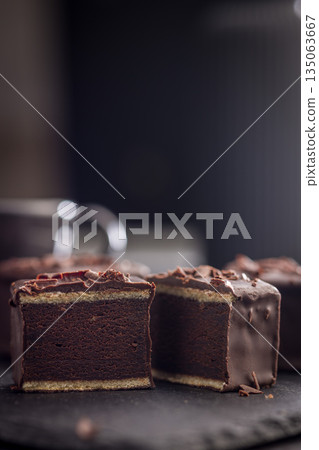 Sweet dessert cake. Mini pie on black table. Sweet dessert cake. Mini pie on black table. 135063667