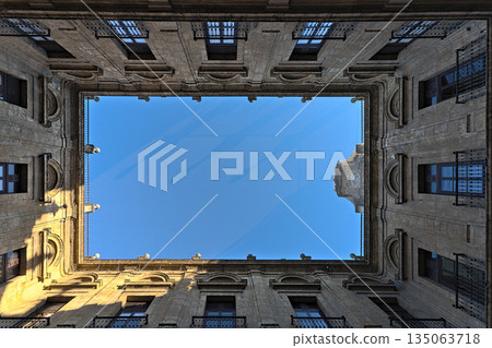 A courtyard in the Royal Tobacco Factory of Seville photographed from below 135063718
