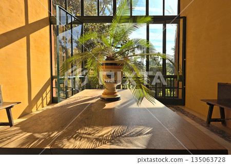 View through the window to the garden of the Alkazar of Seville View through the window to the garden of the Alkazar of Seville 135063728