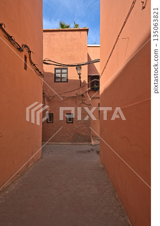 Red colored houses in Marrakesh and an alley Red colored houses in Marrakesh and an alley 135063821