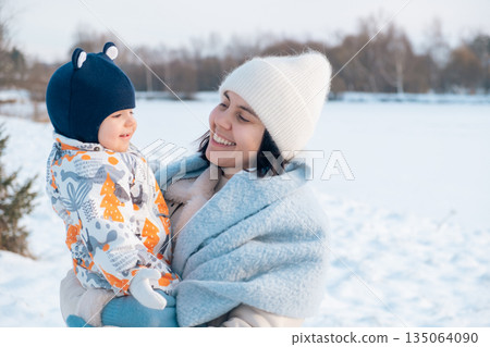 Mother and Baby Enjoying a Winter Day Mother and Baby Enjoying a Winter Day 135064090