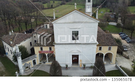 Aerial view of the historic Santa Maria Assunta Church, known as La Rotonda, in Rezzato, Italy. Ancient Romanesque architecture in the Valverde valley, Brescia province 135065078